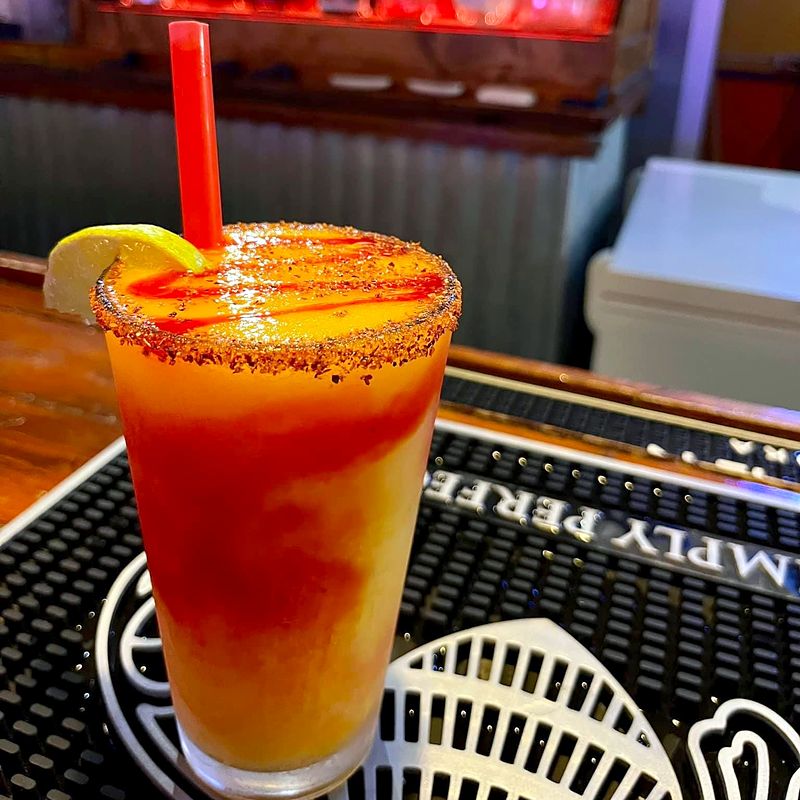 A chili-rimmed cocktail on the bar