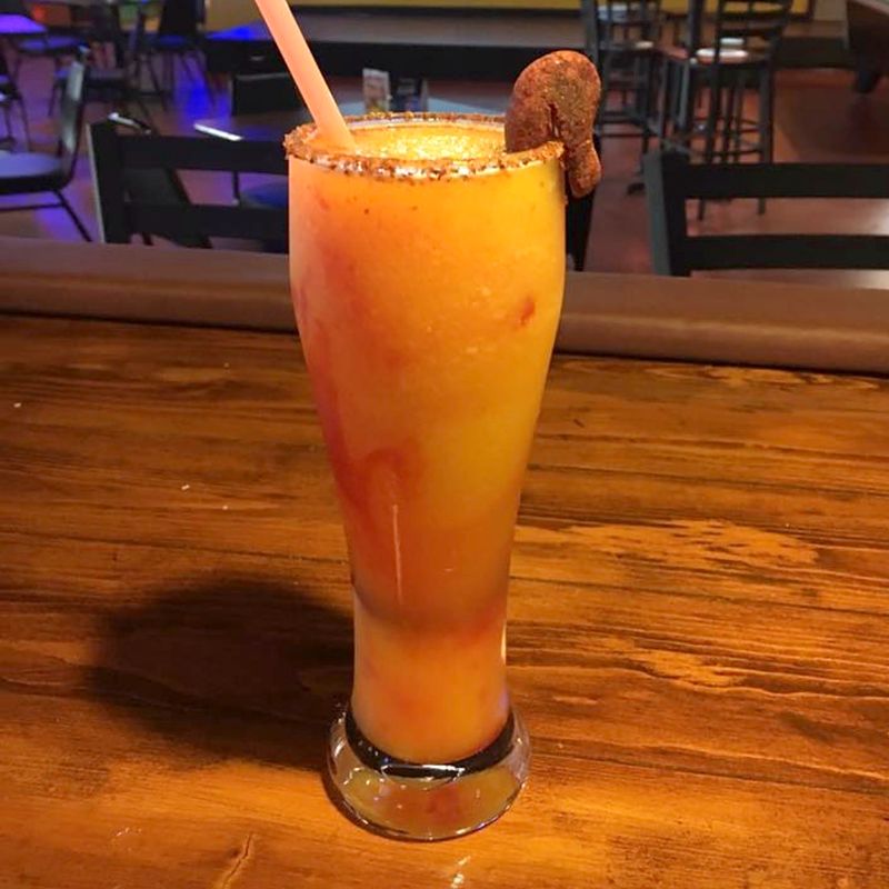A tall chili-rimmed drink in the cantina
