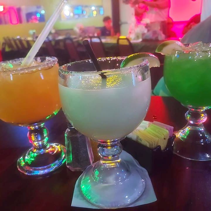 Three margaritas — orange, classic and green — at the Nacho's bar
