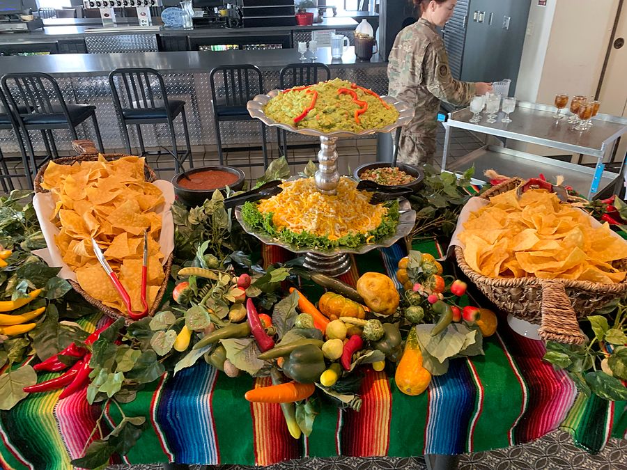 Chips, salsa and guacamole on a serape-draped Nacho's catering table
